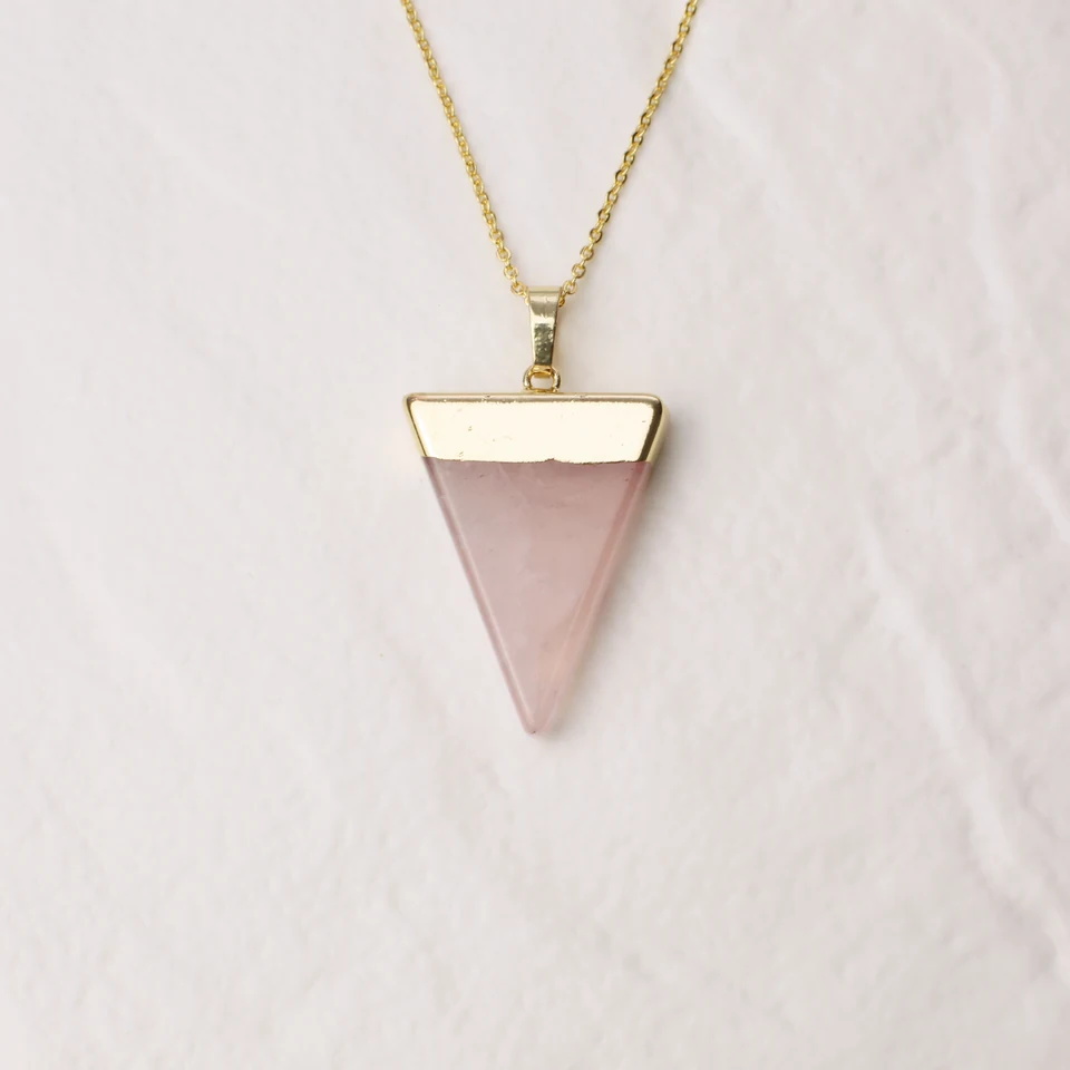 Faceted triangle rose quartz pendant necklace in the seller-edited square Drive photo.