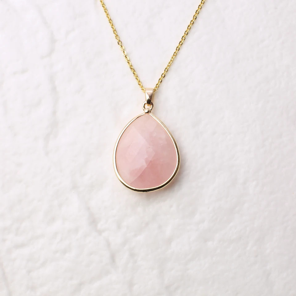 Small teardrop-like rose quartz pendant necklace in the seller-edited square Drive photo.